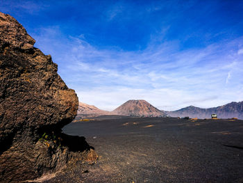 Scenic view of landscape and mountains against sky