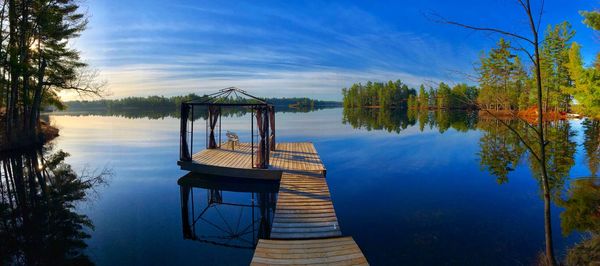 Pier on lake against sky