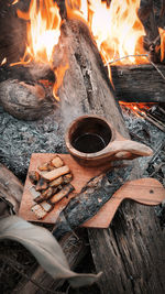 High angle view of bonfire on barbecue grill