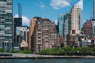 Buildings in city against sky