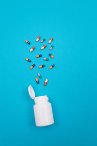 High angle view of bottle against blue background