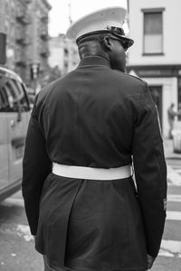 Rear view of man standing on street
