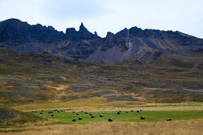 Scenic view of landscape and mountains against sky