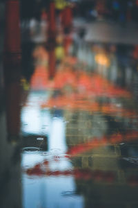 Blurred motion of wet car on road