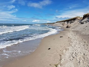 Scenic view of beach against sky