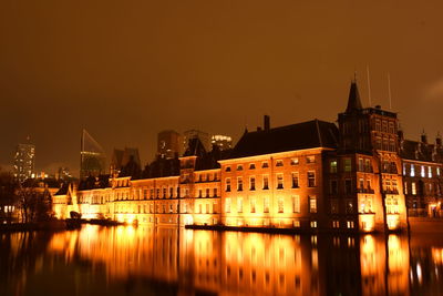 Illuminated buildings in water