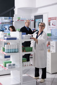 Portrait of woman standing in laboratory