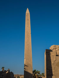 Low angle view of castle against blue sky