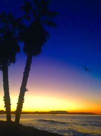 Scenic view of landscape against sky at sunset