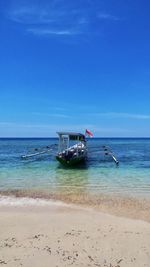 Scenic view of sea against blue sky