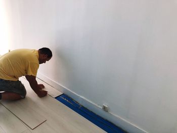 Man working on floor at home