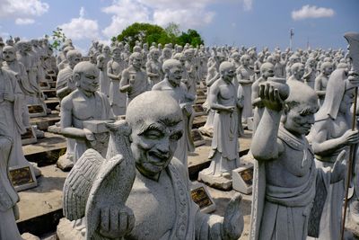 Panoramic view of buddha statue against sky