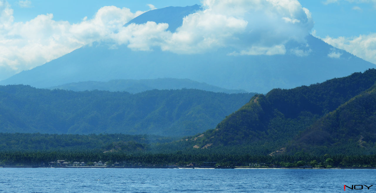 SCENIC VIEW OF LAKE WITH MOUNTAINS IN BACKGROUND