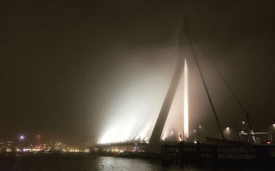 Illuminated suspension bridge at night