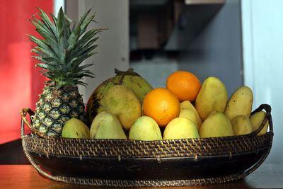 Fruits in basket on table