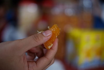 Close-up of hand holding apple