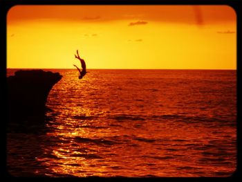 Scenic view of sea at sunset