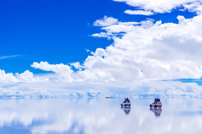 Scenic view of snow covered landscape against blue sky