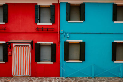 Red and blue colored houses in burano