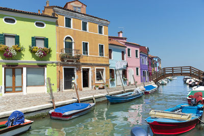 Colorful burano landscape with boats in a sunny day