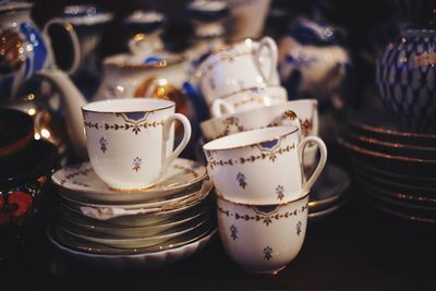 Close-up of coffee cups on table