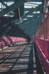 People walking on railway bridge