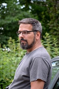 Portrait of man wearing mask against plants