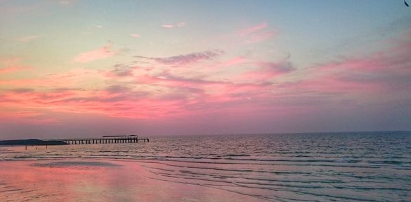 Scenic view of sea against sky at sunset