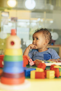 Portrait of cute boy playing with toy