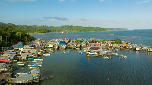 Village of fishermen with houses on the water, with fishing boats. 