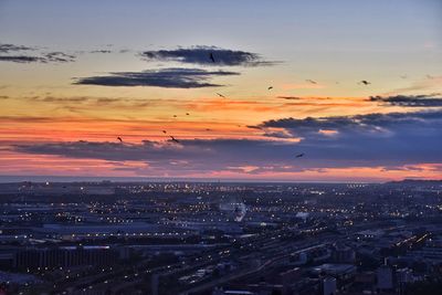 High angle view of buildings against sky during sunset