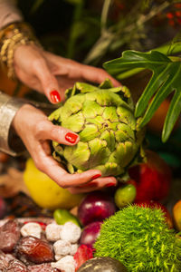 Close-up of hand holding fruit