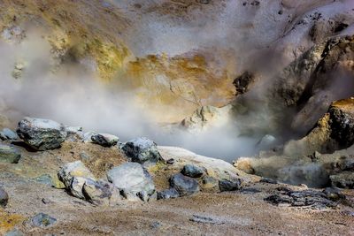 View of steam emitting from hot spring