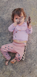 High angle view of young woman standing on street