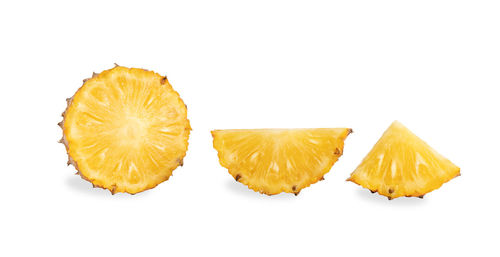 Close-up of orange slice against white background