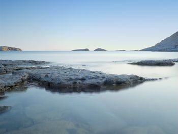 Scenic view of sea against clear blue sky