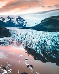 Scenic view of frozen lake against sky during winter