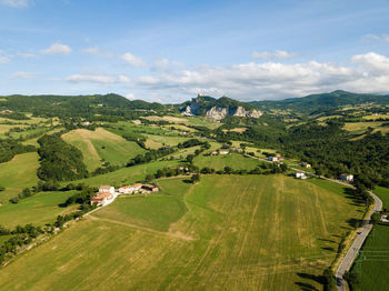 Scenic view of agricultural landscape against sky