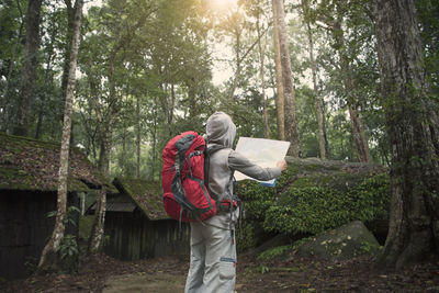 Full length of man walking in forest