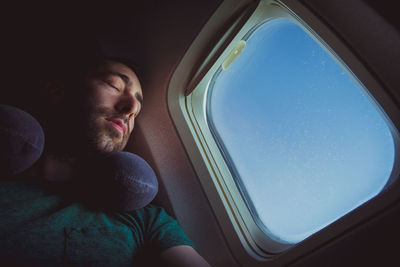 Man sleeping in airplane