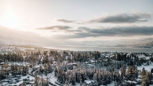 Scenic view of frozen lake against sky during winter