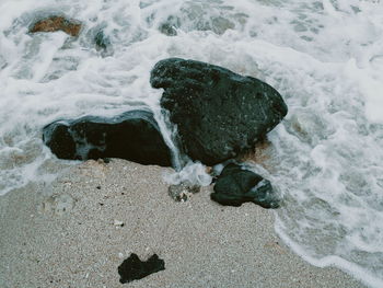 High angle view of rocks in sea