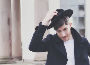 Mid adult man wearing hat outdoors