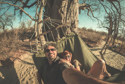 Portrait of smiling couple in hammock