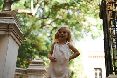 Portrait of young woman standing outdoors