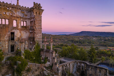 Drone aerial panorama of termas radium hotel serra da pena at sunset in sortelha, portugal