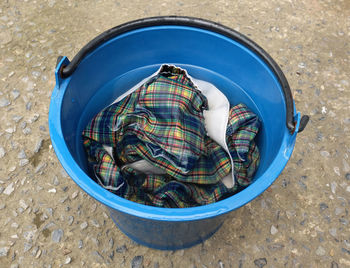 
clothes soaked in a tub for hand washing.