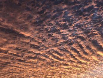 Low angle view of dramatic sky during sunset