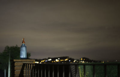 Illuminated building against sky at dusk