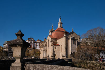 Low angle view of historic building against clear blue sky